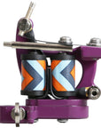 Purple heart tattoo machine with colorful coil wraps on a white background