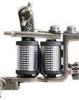 Side profile of a Jonesy-style one-off coil liner tattoo machine by Lucky Supply with reflective chrome-style wrapped coils, hinged tube vice, and compact handmade frame.