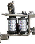 Side profile of a Jonesy-style one-off coil liner tattoo machine by Lucky Supply with reflective wrapped coils, hinged tube vice, and compact handmade frame.