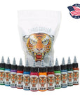 Collection of Chris Garver tattoo ink bottles with a tiger design on a white background.