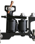 Close-up of a precision tattoo machine with a 'Made in USA' engraving. Features custom-wrapped coils and a polished finish, reflecting traditional American craftsmanship.