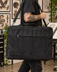 Person carrying Artist Bag