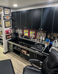 tatoo shop interior with black chairs, counter, and various tattoo supplies