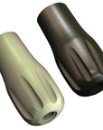 Two tattoo machine grips, one in a matte limestone finish and the other in a polished stainless steel finish.