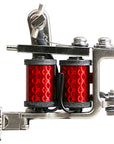 Side profile of a Jonesy-style one-off coil liner tattoo machine featuring deep red custom wrapped coils, black wiring, and compact handmade frame.