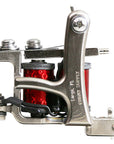 Jonesy-style one-off coil liner tattoo machine handmade by Lucky Supply with deep red wrapped coils, silver frame, and tuned liner setup.