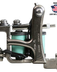 Jonesy-style one-off coil liner tattoo machine by Lucky Supply with mint green wrapped coils displayed beside Proudly Made in USA Lucky MFG Largo, FL graphic.