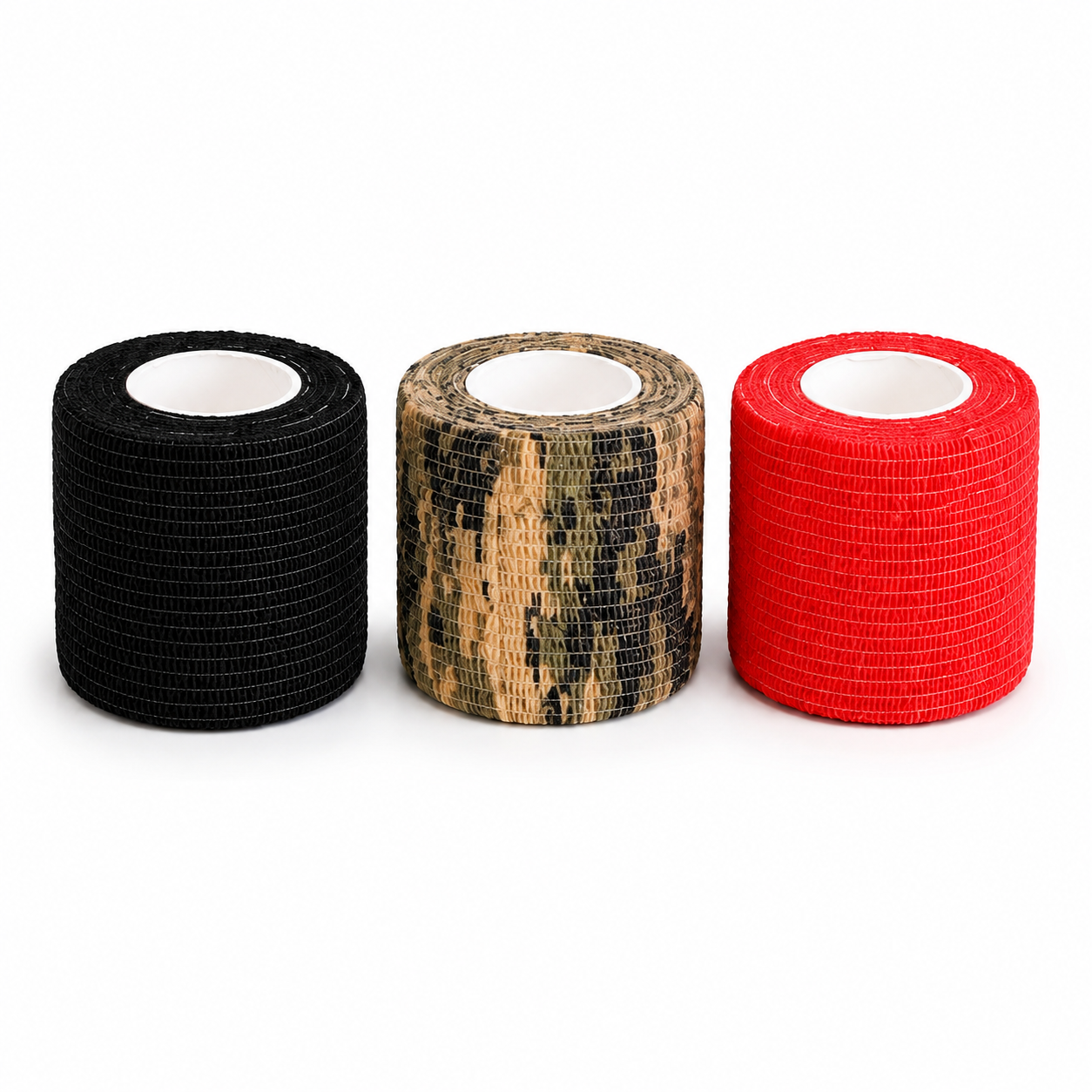 Three rolls of coflex tape on a white background: one black, one camouflage in tan and black, and one bright red.