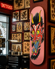 Brad Fink Skateboard Deck on Wall of Tattoo Shop