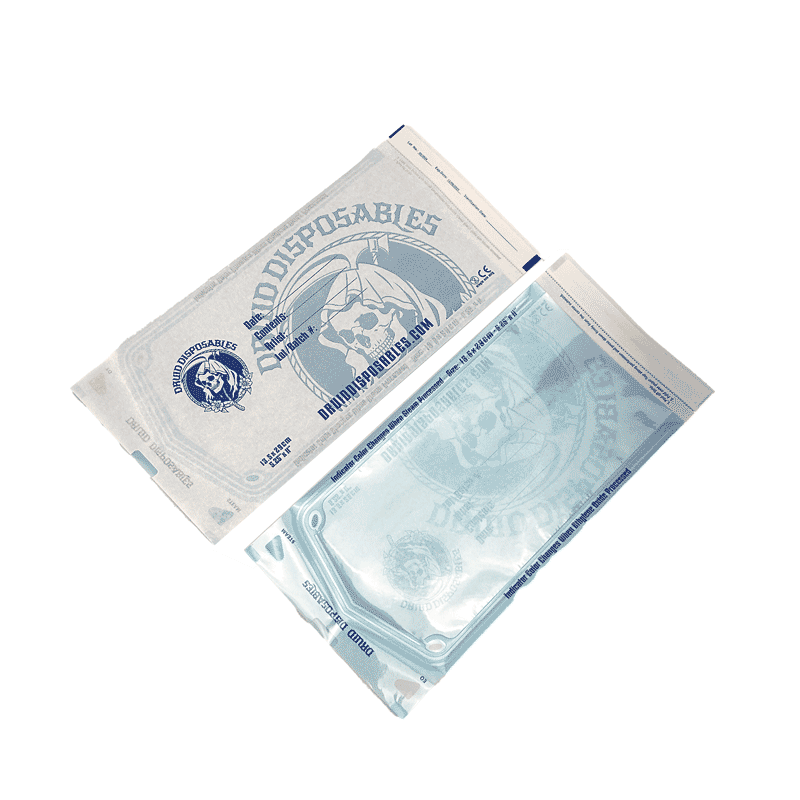 A box of Druid Disposables self-sealing sterilization pouches, shown with two individual foil pouches in front on a white background.