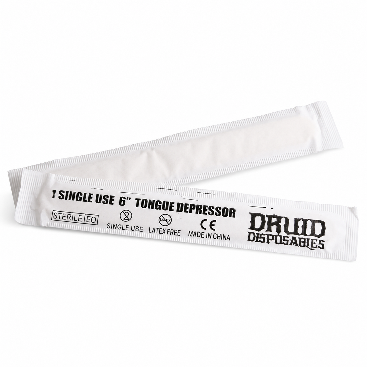 Two individually wrapped white single-use 6-inch tongue depressors with black printed text, including the brand name DRUID DISPOSABLES, on a plain white background.
