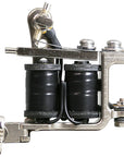 Side profile of a Jonesy-style Electric Black coil liner tattoo machine with black wrapped coils, drilled frame holes, and traditional handmade construction.