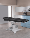 Lemi Tesera Power Procedure Chair fully reclined for tattoo sessions, cosmetic procedures, and medical treatments.