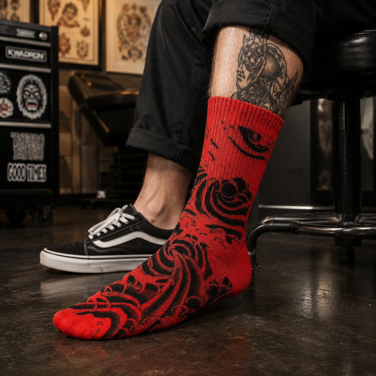 A single crew sock with a dark gray and black abstract wave-like pattern, shown against a plain white background.