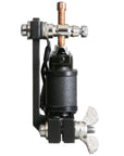 Close-up of a precision tattoo machine with a 'Made in USA' engraving. Features custom-wrapped coils and a polished finish, reflecting traditional American craftsmanship.
