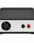 A rectangular electronic device with a black casing and a brushed silver front panel, featuring a black cooling fan on the left and two terminal connectors on the right, one black and one red.