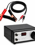 A portable electronic device with a black casing and silver front panel, shown alongside red and black alligator clips on a black cable. The device features a digital LED display showing 14.5