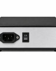 A rectangular electronic power supply or UPS unit with a brushed silver front panel, black casing, a three-pin power inlet, and a black on/off switch, shown on a plain white background.