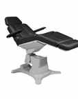 Side profile of the Lemi Tesera electric procedure chair with integrated arm rests and ergonomic design.