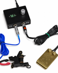 Lucky MFG stamped tattoo foot switch in professional tattoo workstation