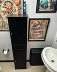 Bathroom with tattoo flash on the wall and a sink.