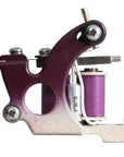 Lucky MFG Universal Hinged coil shader tattoo machine with custom plum and cream finish – frame side