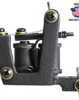 A black V Frame Liner Tattoo Machine with visible brand logo and American flag emblem indicating it is made in the USA.