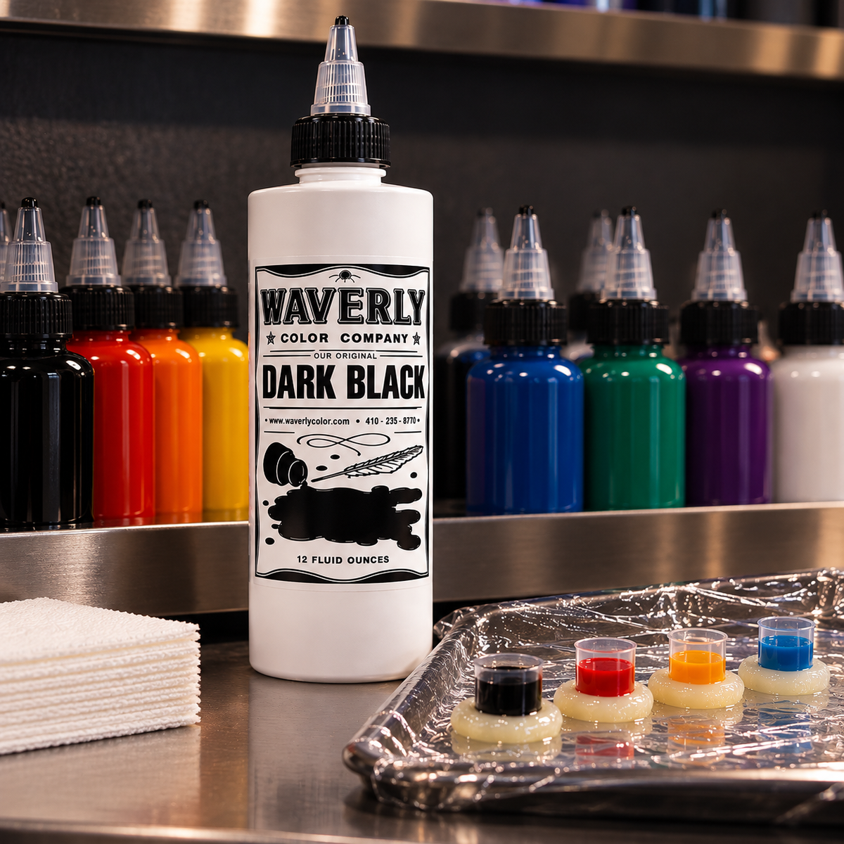 Waverly Dark Black tattoo ink on a professional workstation with colored inks and prepared ink caps
