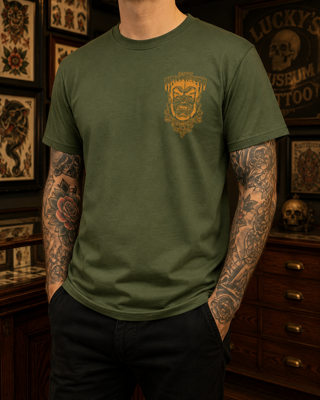Green t-shirt with a graphic design on the back featuring a face and text.